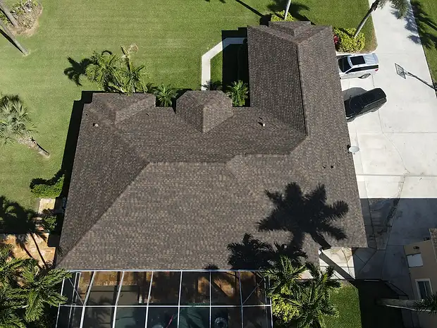 Top-down aerial of a home with a new brown shingle roof
