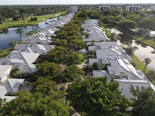 Aerial view of a lakefront community with new roofs